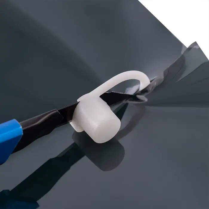 Outil de découpe de film teinté pour vitres