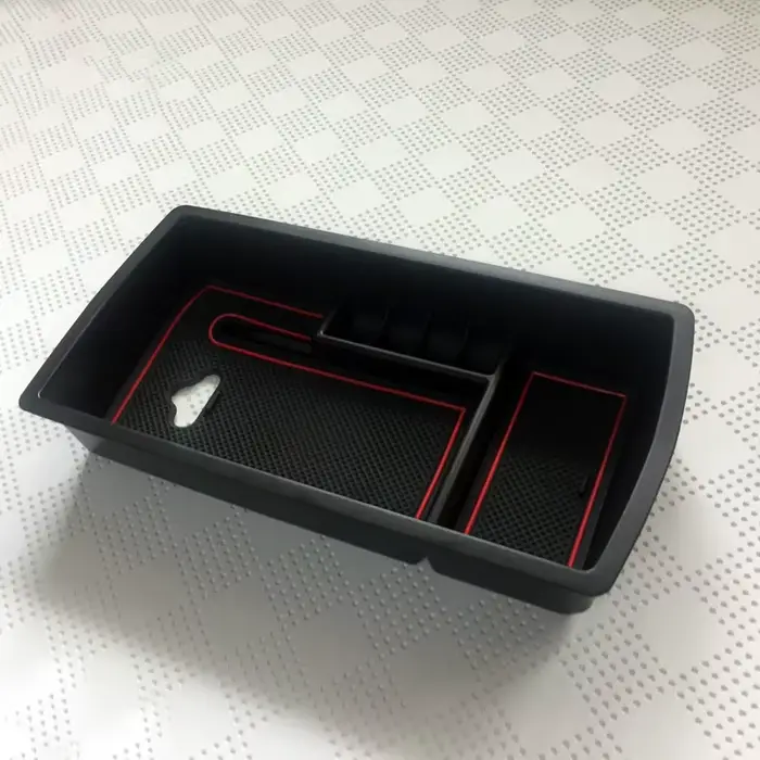 Boîte de rangement pour accoudoir central