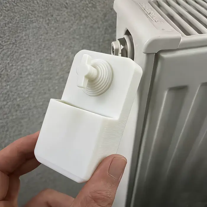 Clé de purge de radiateur avec boîte de récupération d'eau anti-débordement